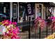 Charming storefront with flower boxes on the railing and an 'OPEN' sign at 64 Shay St, Angier, NC 27501