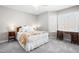 Cozy bedroom features neutral walls, gray carpet, and natural light from a charming bay window at 6600 Ascot Ct, Raleigh, NC 27615