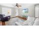 Spacious living room featuring a mounted TV, ceiling fan and hardwood floors at 6600 Ascot Ct, Raleigh, NC 27615