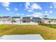 Neighborhood backyard with a grassy lawn and homes at 669 Impala Trce, Wendell, NC 27591