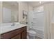 Bathroom with a shower-tub combination, a single sink vanity, and contemporary fixtures at 669 Impala Trce, Wendell, NC 27591