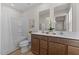 Bathroom showcasing a double sink vanity, a shower-tub combination, and modern fixtures at 669 Impala Trce, Wendell, NC 27591
