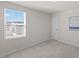Sunlit bedroom featuring a window and neutral walls at 669 Impala Trce, Wendell, NC 27591