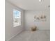 Bright bedroom with a neutral color palette, plush carpeting, and large window at 669 Impala Trce, Wendell, NC 27591