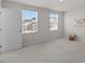 Bright bedroom features plush carpeting and two windows providing ample natural light at 669 Impala Trce, Wendell, NC 27591