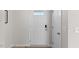 Bright foyer showcasing a modern white front door and clean, minimalist design at 669 Impala Trce, Wendell, NC 27591