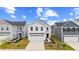 Beautiful two-story home with a two car garage and a well-manicured lawn on a sunny day at 669 Impala Trce, Wendell, NC 27591