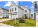 Lovely two-story home with a two car garage and a green lawn under a bright blue sky at 669 Impala Trce, Wendell, NC 27591