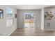 Bright living room featuring wood-look flooring and sliding glass doors leading to the backyard at 669 Impala Trce, Wendell, NC 27591