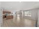 Spacious open-concept kitchen and living room with hardwood floors and recessed lighting at 669 Impala Trce, Wendell, NC 27591