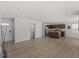 Spacious open-concept kitchen and living room with hardwood floors and recessed lighting at 669 Impala Trce, Wendell, NC 27591