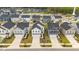 Charming new construction homes lining a street, with neatly maintained lawns and paved driveways at 669 Impala Trce, Wendell, NC 27591