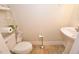 Powder room with pedestal sink and ceramic floors at 730 Duck Pond Rd, Nashville, NC 27856
