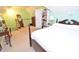 Bedroom with neutral walls and adjacent stairs at 730 Duck Pond Rd, Nashville, NC 27856