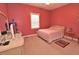 Bright bedroom with natural light and pink walls at 730 Duck Pond Rd, Nashville, NC 27856
