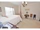 Bedroom with carpet and featuring a four-poster bed, decorative lighting, and classic furnishings at 730 Duck Pond Rd, Nashville, NC 27856