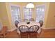 Cozy breakfast nook featuring a round table, comfortable seating, and natural light from surrounding windows at 730 Duck Pond Rd, Nashville, NC 27856