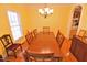 Cozy dining room with wood table, hardwood floors, and classic lighting at 730 Duck Pond Rd, Nashville, NC 27856