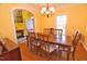 Inviting dining room with hardwood floors, classic lighting, and ample seating at 730 Duck Pond Rd, Nashville, NC 27856