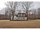 Traditional-style home with a covered porch and a spacious front yard at 730 Duck Pond Rd, Nashville, NC 27856