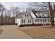 A spacious home with an attached garage and a welcoming front porch at 730 Duck Pond Rd, Nashville, NC 27856