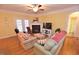 Cozy living room featuring a fireplace, comfortable seating, and natural light at 730 Duck Pond Rd, Nashville, NC 27856