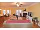 Bright living room with a fireplace, comfortable seating, and hardwood floors at 730 Duck Pond Rd, Nashville, NC 27856