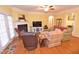 Spacious living room boasting hardwood floors, a fireplace, and comfortable seating arrangements at 730 Duck Pond Rd, Nashville, NC 27856