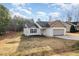 Charming one-story home featuring a two-car garage, gray roof, and a well-maintained front yard at 75 Cherryhill Dr, Four Oaks, NC 27524