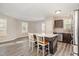 Eat in kitchen with stainless steel appliances, granite countertops, and wood-look flooring at 75 Cherryhill Dr, Four Oaks, NC 27524