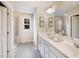 Serene bathroom with double sinks, a luxurious glass shower, and ample natural light at 810 Spoonbill Ct, Durham, NC 27703