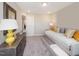 Neutral bedroom with a daybed, dresser, and neutral carpet at 810 Spoonbill Ct, Durham, NC 27703