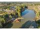 Aerial view of property with lake, dock, and surrounding woods at 1027 Laurelwood Dr, Durham, NC 27705