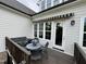 Back deck featuring outdoor seating and entry into the home at 1027 Laurelwood Dr, Durham, NC 27705