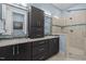 Modern bathroom featuring double vanity, granite counters and glass enclosed shower at 1027 Laurelwood Dr, Durham, NC 27705