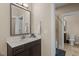 Bathroom with modern fixtures, marble counters, and tile flooring at 1027 Laurelwood Dr, Durham, NC 27705