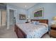 Serene bedroom featuring natural light, comfortable furniture, and calming blue walls at 1027 Laurelwood Dr, Durham, NC 27705