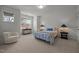 Bright bedroom with a queen bed, neutral colors and an abundance of natural light at 1027 Laurelwood Dr, Durham, NC 27705