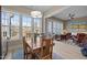 Dining room with natural light, wood table, and view to the sun room at 1027 Laurelwood Dr, Durham, NC 27705