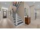 Hallway featuring stairs, neutral paint color, and bright lighting at 1027 Laurelwood Dr, Durham, NC 27705