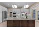 Beautiful kitchen with stainless appliances, white cabinets, granite counters, and a central island at 1027 Laurelwood Dr, Durham, NC 27705