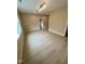 Bright, neutral living room with hardwood floors and recessed lighting at 1027 Laurelwood Dr, Durham, NC 27705