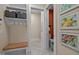 Well-organized mud room with built-in bench, storage, and access to a half bath at 1027 Laurelwood Dr, Durham, NC 27705