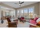 Cozy sunroom with plentiful natural light and comfortable seating, perfect for relaxation at 1027 Laurelwood Dr, Durham, NC 27705