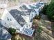 Aerial view of a well-maintained backyard with a deck and green space at 1028 Dotson Way, Apex, NC 27523