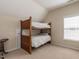 Bedroom featuring carpet and wooden bunk beds with white comforters under a window at 1028 Dotson Way, Apex, NC 27523