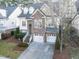 Charming two-story home with stone accents and a well-manicured lawn at 1028 Dotson Way, Apex, NC 27523