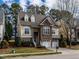Exterior view of a charming house with a lawn and stone accents at 1028 Dotson Way, Apex, NC 27523