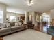 Open-concept living room with hardwood floors, neutral colors, and seamless flow to other living areas at 1028 Dotson Way, Apex, NC 27523