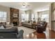 Spacious living room with stone fireplace, hardwood floors, and plenty of natural light at 1028 Dotson Way, Apex, NC 27523